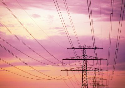 Transmissions lines backed by the colours of a clouds during a sunset